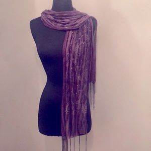 Woman’s festive purple scarf